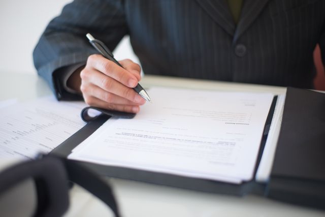 person writing a document