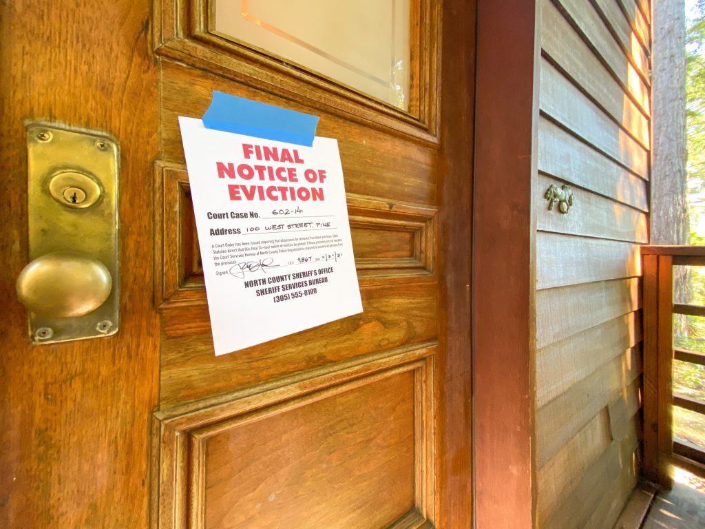 Final notice of eviction taped to a house door