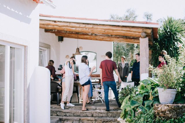 group of people gathered in a backyard