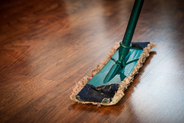 person mopping a floor