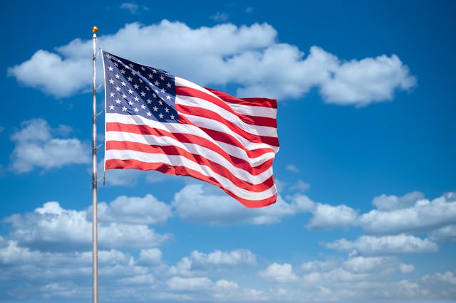 An american flag waving in the wind
